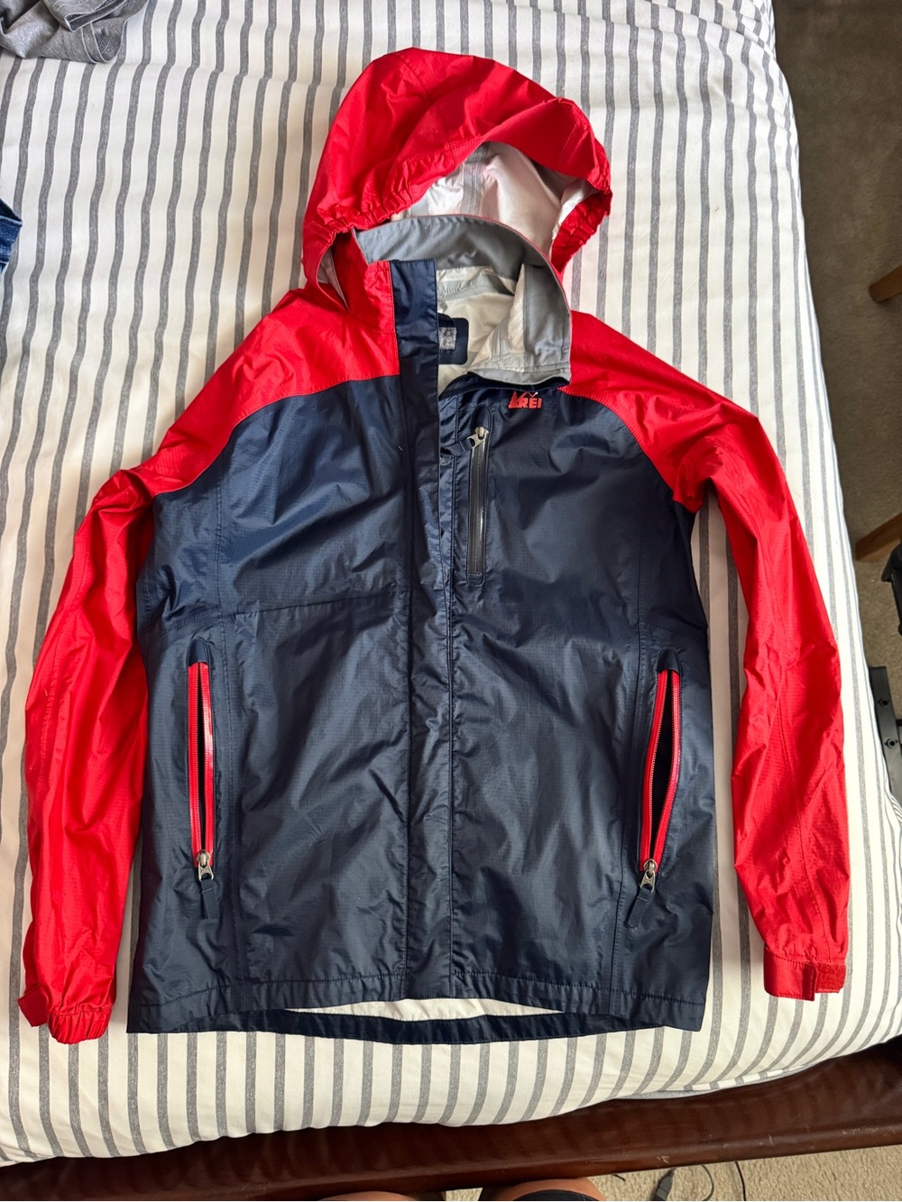 REI Navy and Red Hooded Packable Windbreaker Jacket